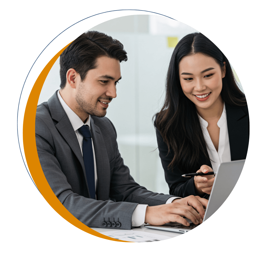 Two professionals reviewing information on a laptop in an office