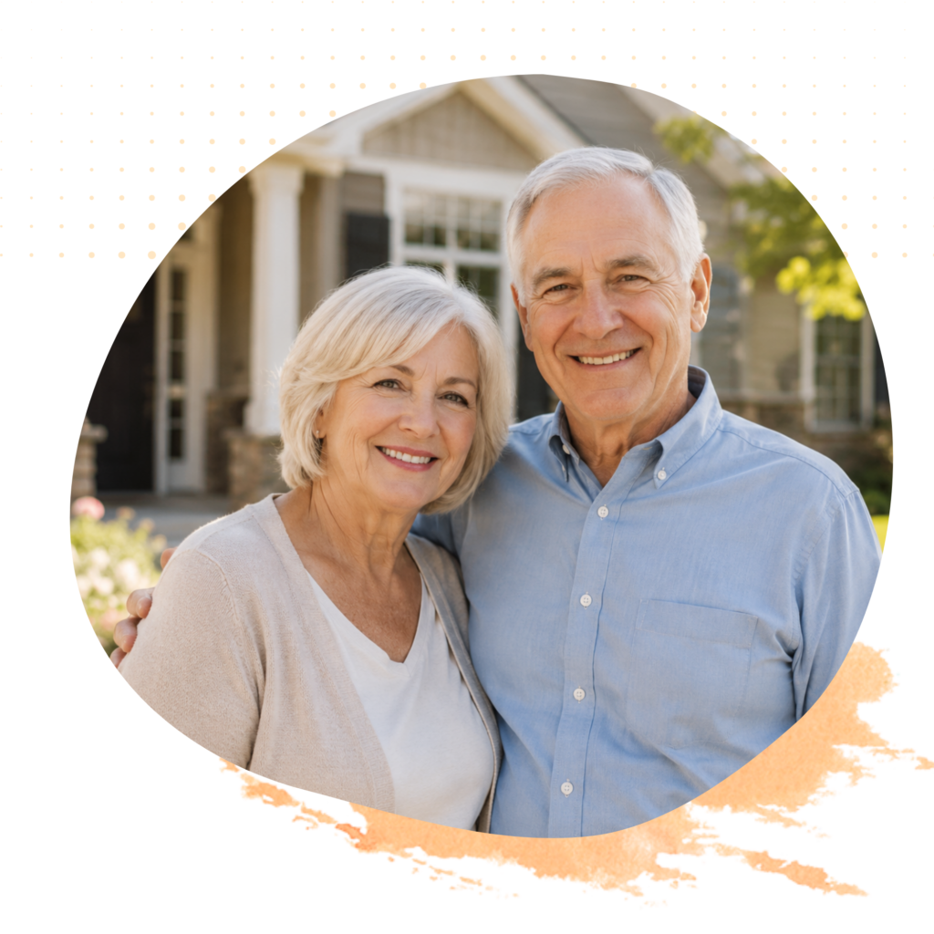 Happy senior couple standing together outside their home.